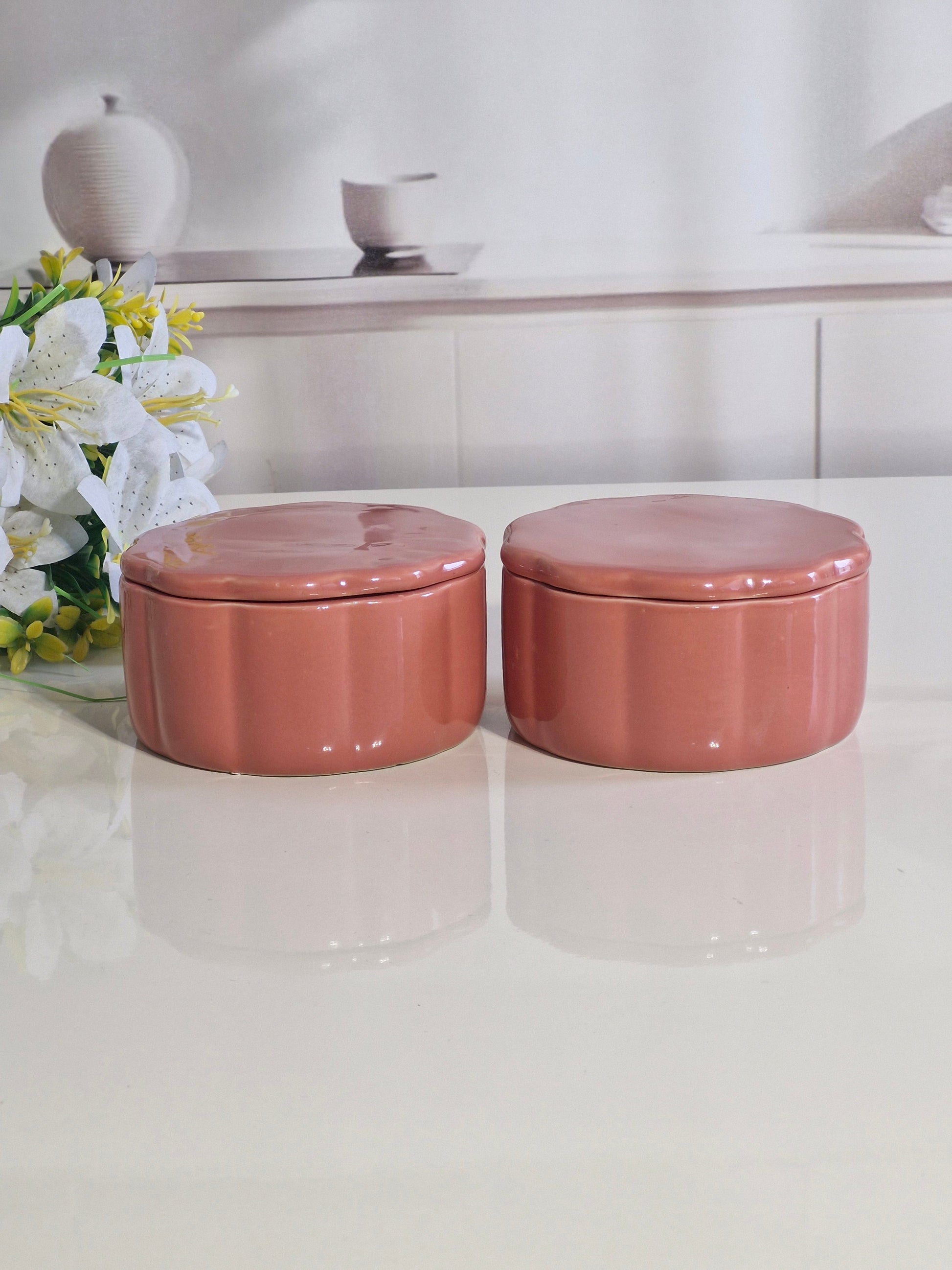Hand holding ceramic snack bowl with lid