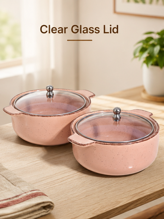 Blush speckled ceramic serving bowl set on wooden surface
