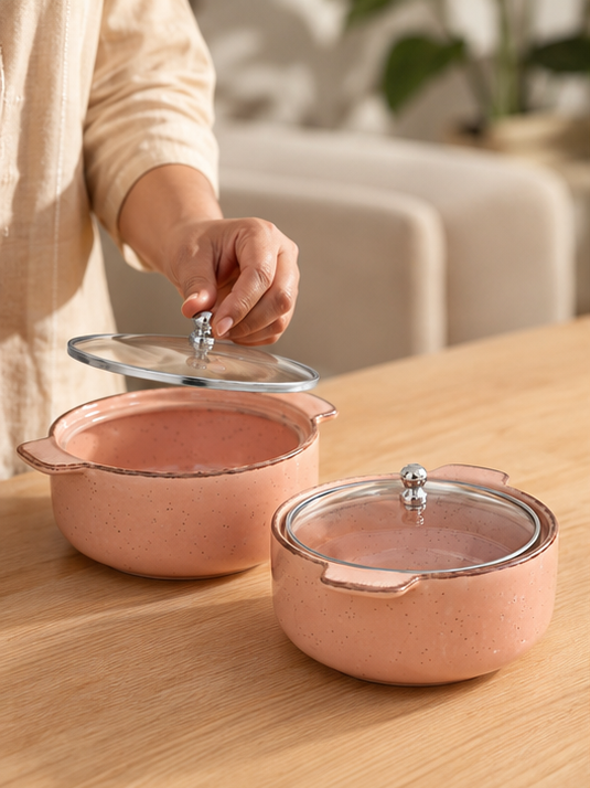 Blush ceramic serving bowl filled with biryani